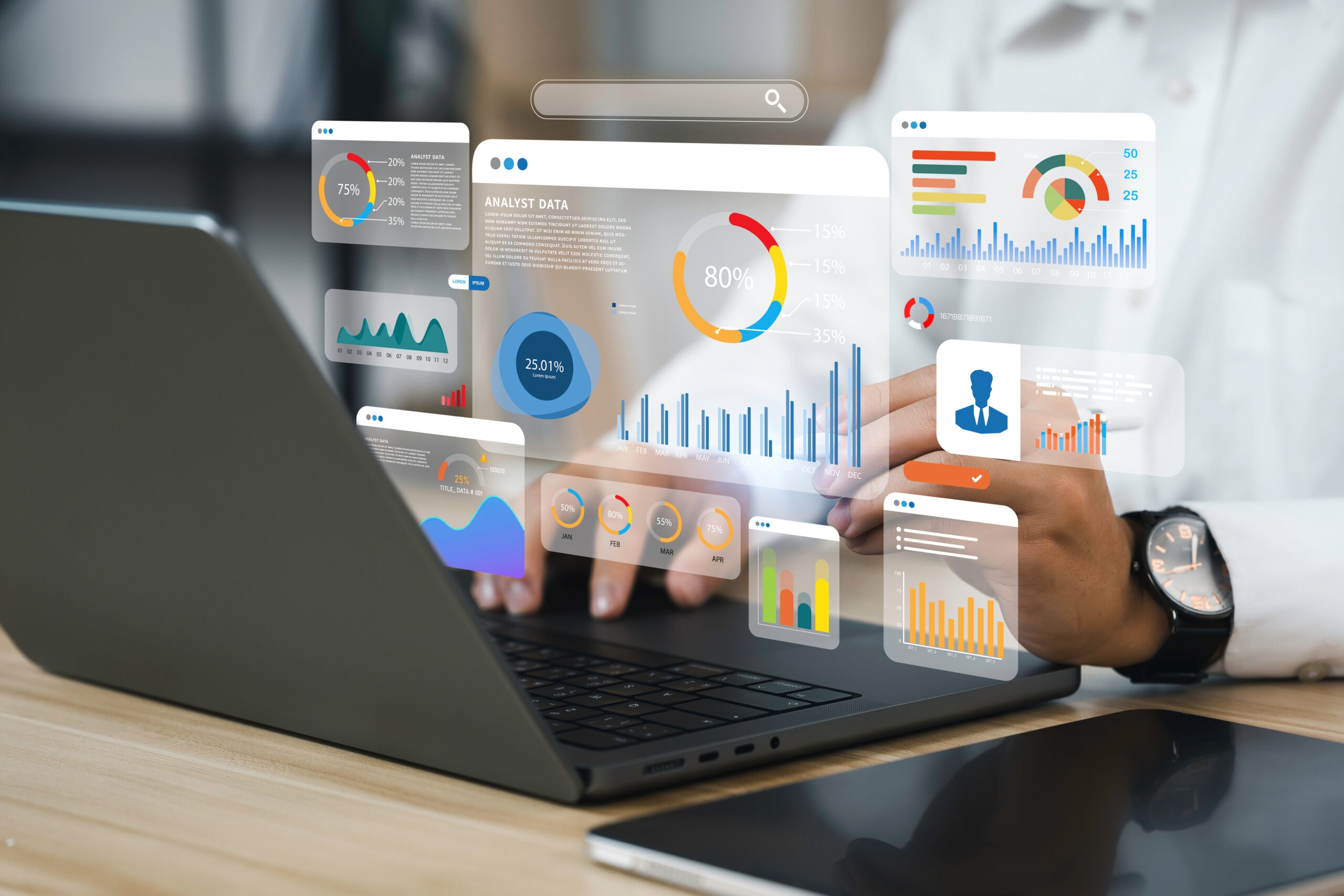 An analyst uses a computer and dashboard for data business analy