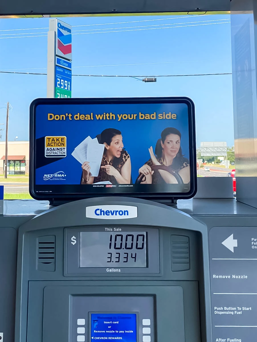 Ad against distracted driving at a gas station